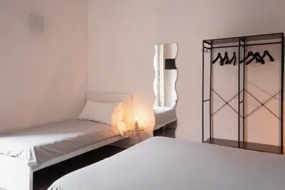 Letto o letti in una camera di Duomo & University Rooms Catania Center