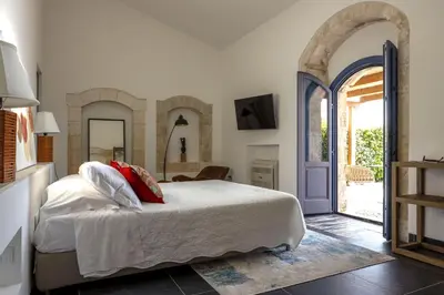 Letto o letti in una camera di Masseria del Carrubo