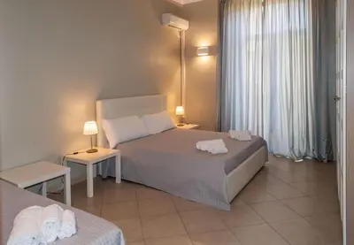 Letto o letti in una camera di Katane Holidays