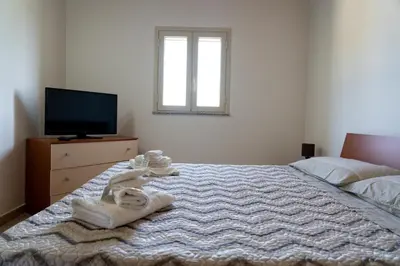 Letto o letti in una camera di B&B L'Uliveto Rooms & Pool