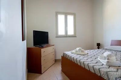 Letto o letti in una camera di B&B L'Uliveto Rooms & Pool