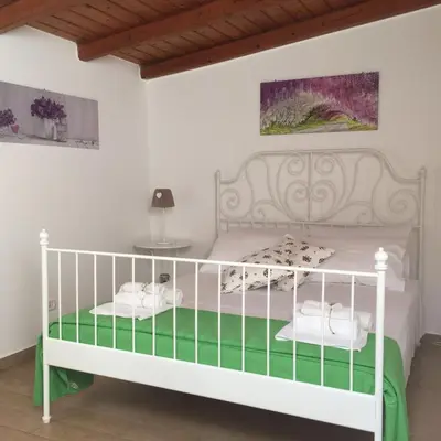 Letto o letti in una camera di Villetta Vivaldi