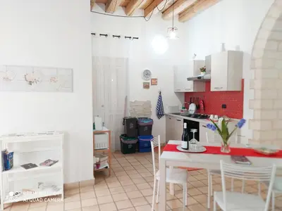 Cucina o angolo cottura di Appartamento Dammuso Isola Di Ortigia