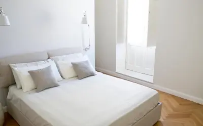 Letto o letti in una camera di Alma Ortigiapart