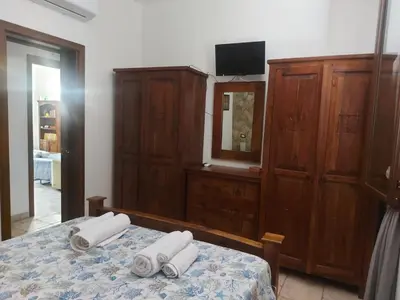 Letto o letti in una camera di Elorina Sicily Home
