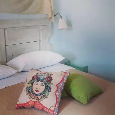 Letto o letti in una camera di Sottovento Marzamemi Rooms&Relax