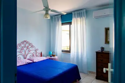 Letto o letti in una camera di Angela home a pochi passi dal mare