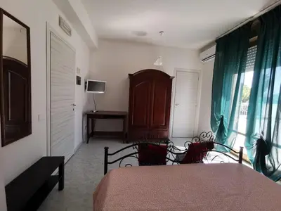 Letto o letti in una camera di B&B Scogli Bianchi