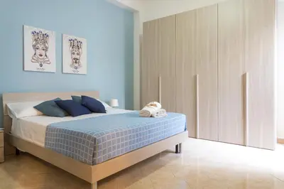 Letto o letti in una camera di Casa Lina con terrazza