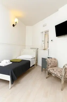 Letto o letti in una camera di Re Bafè