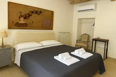 Letto o letti in una camera di Re Bafè