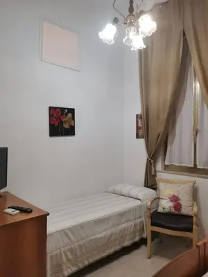 Letto o letti in una camera di Casa Francesca
