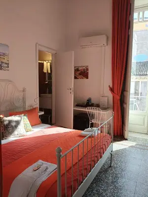 Letto o letti in una camera di B&B Perla