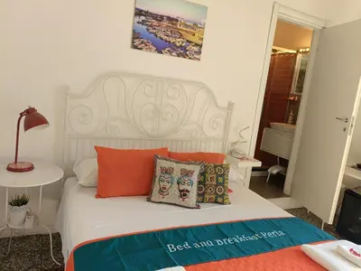 Letto o letti in una camera di B&B Perla
