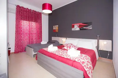 Letto o letti in una camera di B&B Albergo Sicilia City Center