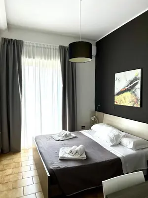 Letto o letti in una camera di B&B Albergo Sicilia City Center