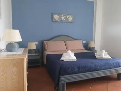 Letto o letti in una camera di Casa Mercurio