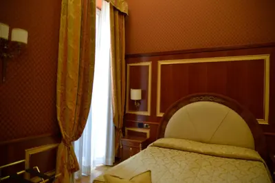 Letto o letti in una camera di Livingston Hotel