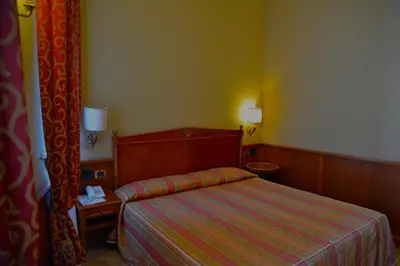 Letto o letti in una camera di Livingston Hotel