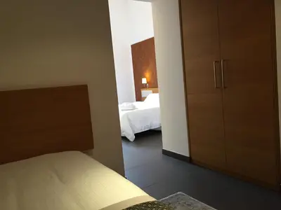 Letto o letti in una camera di Grande Albergo Alfeo