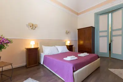 Letto o letti in una camera di B&B Teatro Bellini