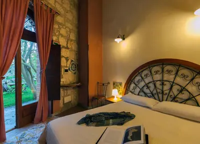 Letto o letti in una camera di Villa Dei Papiri Fonte Ciane