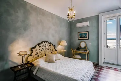 Letto o letti in una camera di Dimora di Ulisse Sea View Holiday Apartment