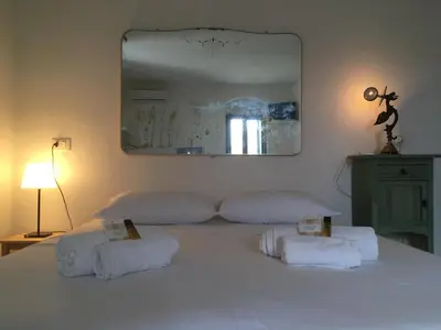 Letto o letti in una camera di Bellassai Homes