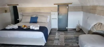 Letto o letti in una camera di Brezza Marina Ortigia