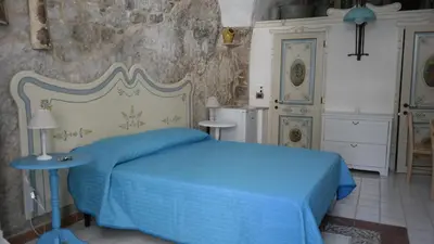 Letto o letti in una camera di Casa MaFaCò