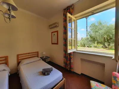Letto o letti in una camera di Villa del Commendatore Sirugo