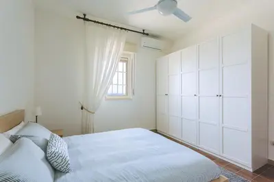 Letto o letti in una camera di Villa del Quarzo