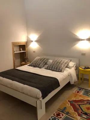 Letto o letti in una camera di Le Stanze di Carlo