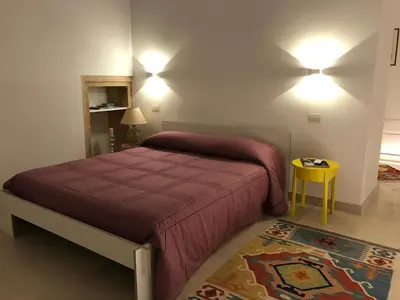 Letto o letti in una camera di Le Stanze di Carlo