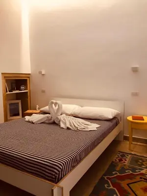 Letto o letti in una camera di Le Stanze di Carlo
