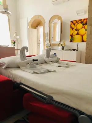 Letto o letti in una camera di Le Stanze di Carlo