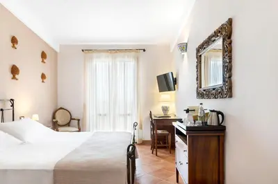 Letto o letti in una camera di Hotel La Corte Del Sole