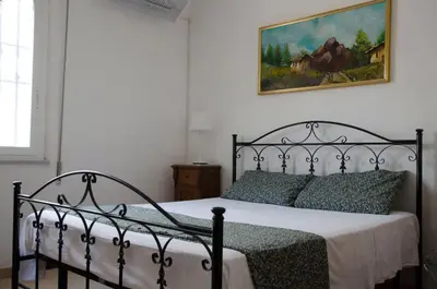 Letto o letti in una camera di Villa Aripè