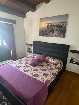 Letto o letti in una camera di Ortigia Deluxe S.A.L.