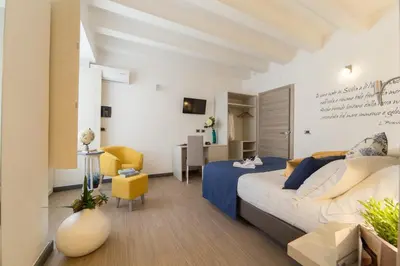Letto o letti in una camera di Palazzo Sisto Exclusive Rooms