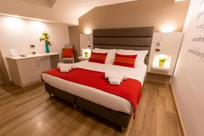 Letto o letti in una camera di Palazzo Sisto Exclusive Rooms
