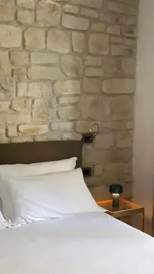 Letto o letti in una camera di Olivia Rooms Teocrito