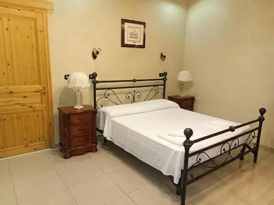 Letto o letti in una camera di Agriturismo PALMERI