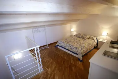 Letto o letti in una camera di DentrOrtigia
