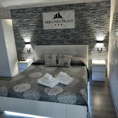 Letto o letti in una camera di B&B Etnea Palace