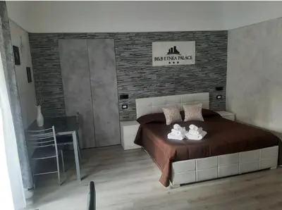 Letto o letti in una camera di B&B Etnea Palace