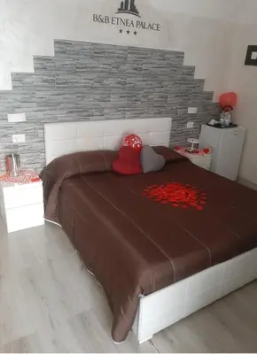 Letto o letti in una camera di B&B Etnea Palace