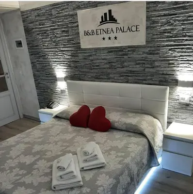 Letto o letti in una camera di B&B Etnea Palace