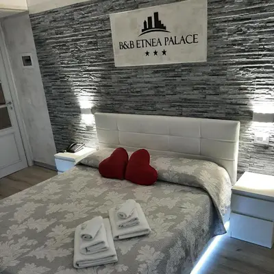 Letto o letti in una camera di B&B Etnea Palace