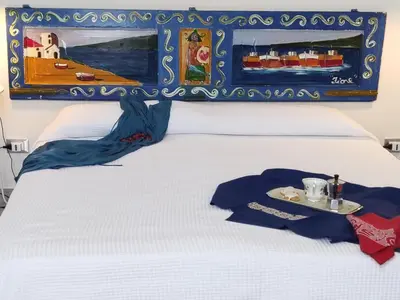 Letto o letti in una camera di House SoleSiculo